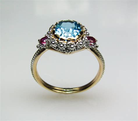Blue Topaz And Ruby Ring In 14k Gold