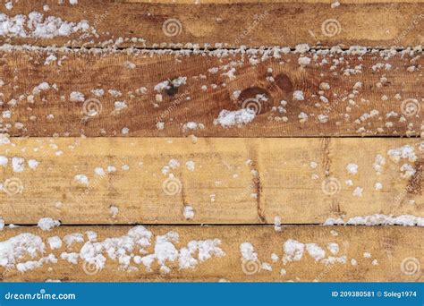 Old Rough Wooden Plank Background Weathered And Covered Snow In Winter