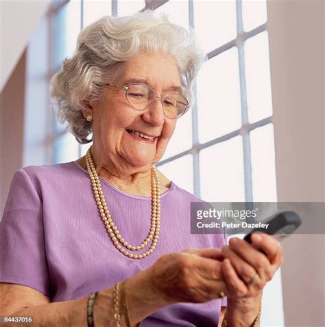 senior woman calling photos and premium high res pictures getty images