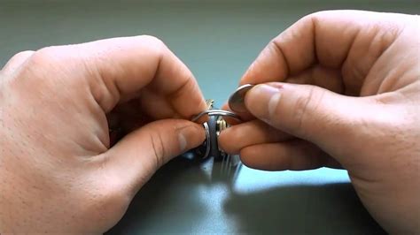 How To Open A Keyring Easily With A Coin Youtube