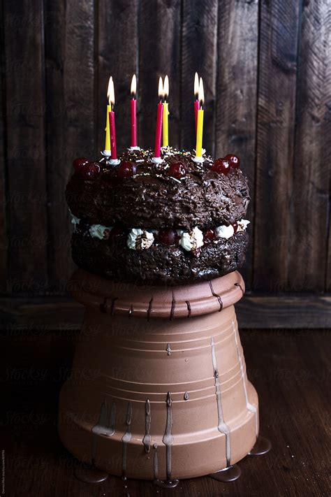 Chocolate Cake With Candles Del Colaborador De Stocksy Darren Muir