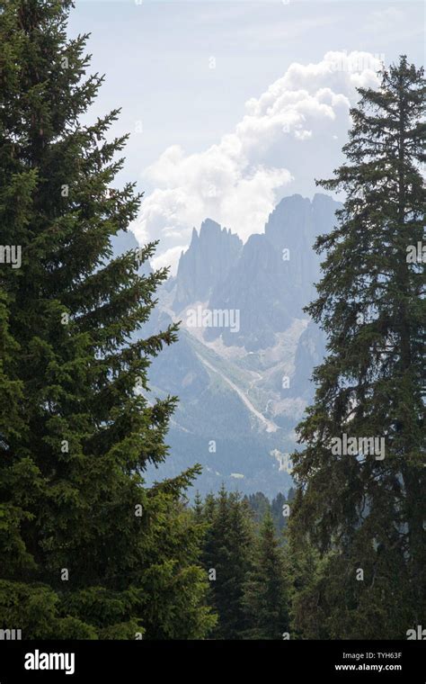 Cloud And Mist Swirling Around The Cliff Faces Of The Langkofel And The