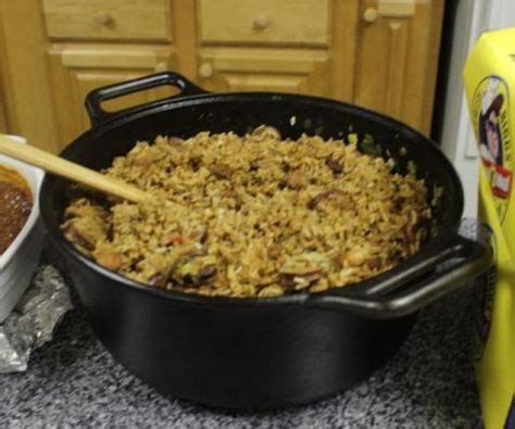 Pour 1 cup chicken broth into the rice mixture. Chef John Folse - Chicken and Sausage Jambalaya ...