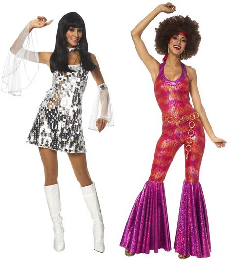 Two Women Dressed In Disco Costumes Posing For The Camera