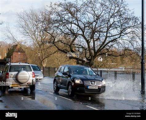 Uk Surrey Cobham Flood Water On Road Splash Stock Photo Alamy