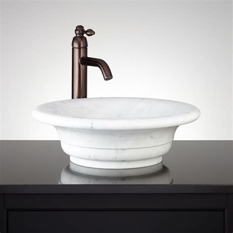 These kinds of sinks were common around the 50s in the small. Curved Rim Carrara Marble Vessel Sink - Bathroom