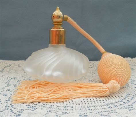 An Orange Object Sitting On Top Of A Table Next To A White Doily