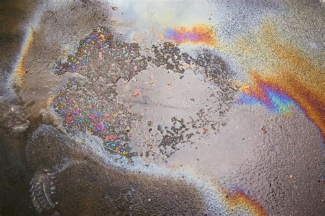 Oil Spill On Asphalt Road Background Or Textureenvironmental Pollution