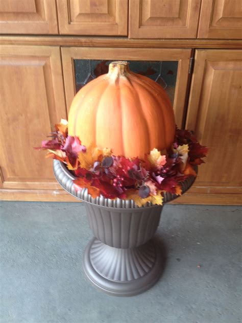 Use What You Have Decoratinga Wreath On Your Planter With A Pumpkin