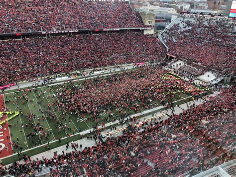 Look Ohio State Storms Field After 62 39 Win Over No 4 Michigan