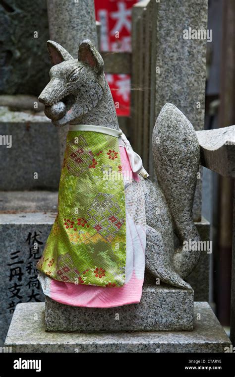 A Statue Of A Kitsune Fox Spirit At The Shrine Of Fushimi Inari
