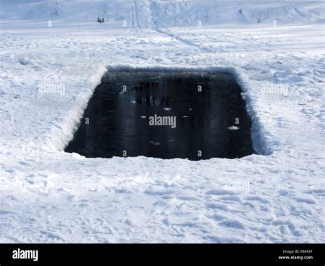 Square Ice Hole In Frozen Lake Stock Photo Alamy
