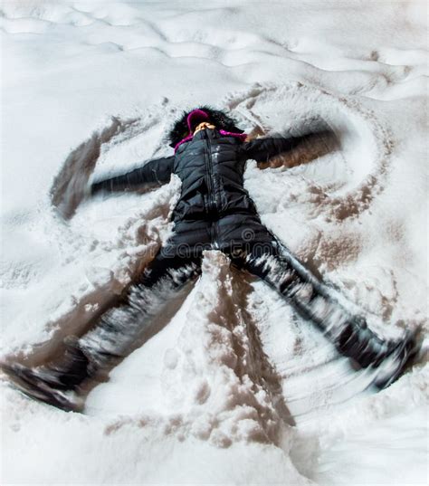 Woman Making Snow Angel On Snow Stock Photo Image Of December Happy