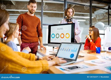 People Working Together On The Computers In The Office Stock Image