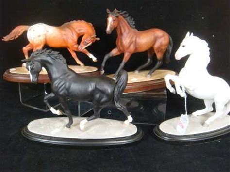 Four Lenox International Horse Sculptures