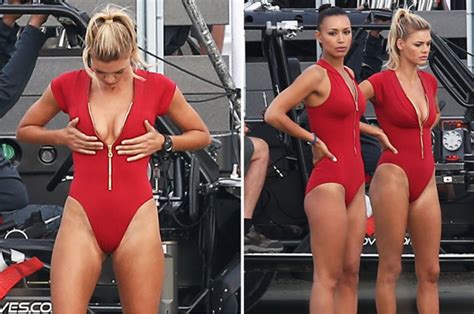 Kelly Rohrbach Checks Out Her Cleavage In Red Swimsuit On Baywatch Set