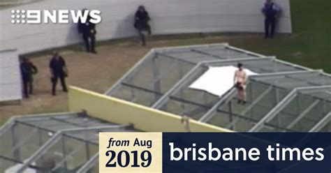 brisbane prison in lockdown as inmates climb onto roof