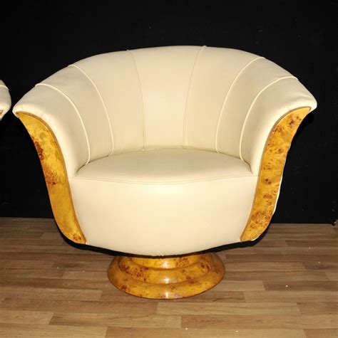 Very nice and colorful swivel chairs with geometrical pattern. Pair Art Deco Club Chairs Swivel Arm Chair