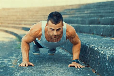 Young Muscular Young Man Doing Push Ups Stock Photo Image Of Fitness