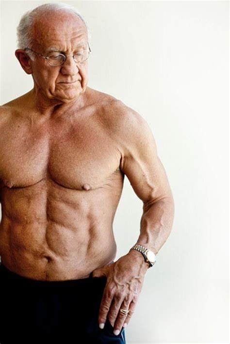 An Older Man With No Shirt On Posing For The Camera While Holding His Hands In His Pockets