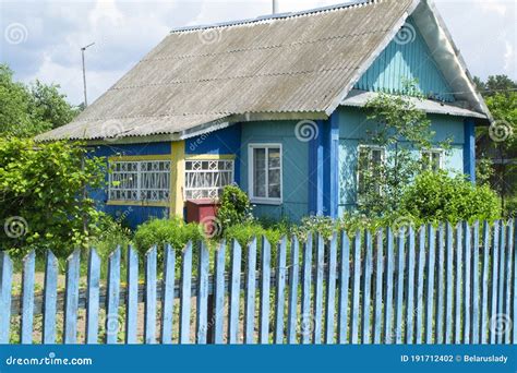 A Traditional Folk Wooden House In Belarus With Colorful Ornamented