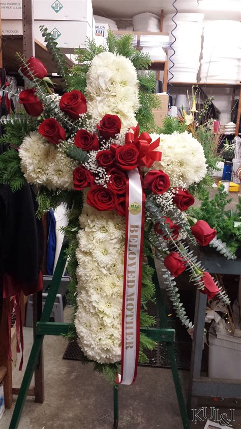 White Cross Funeral Standing Spray With Rose Accents