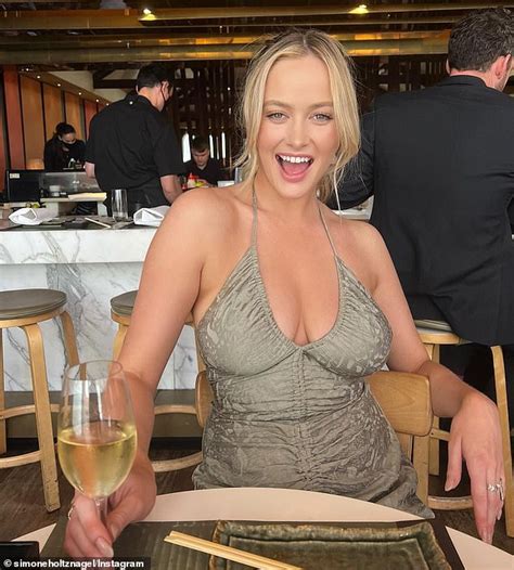 Simone Holtznagel Shows Off Cleavage In A Low Cut Dress As She Dines At