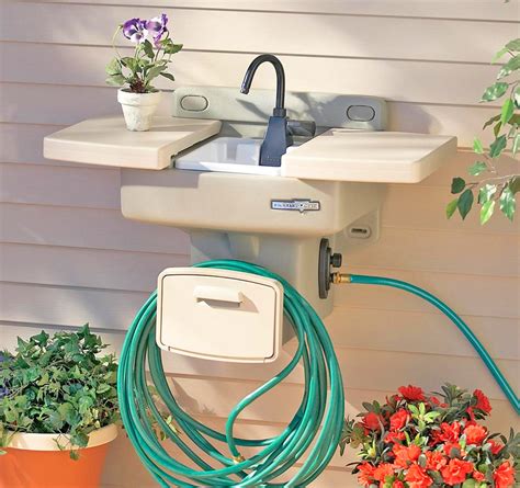 Outdoor sink station with hose reel. This Garden Hose Sink Gives You an Instant Outdoor Sink ...