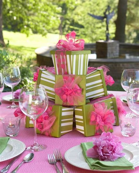 The Table Is Set With Pink Flowers And Green Napkins