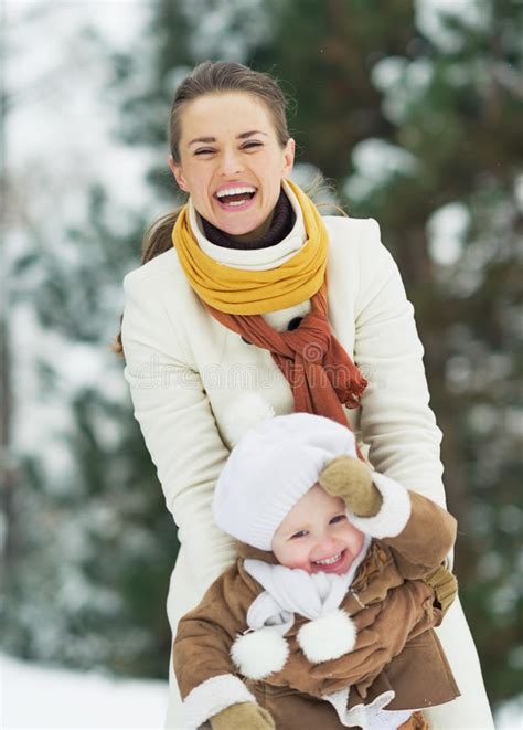 Happy Mother Playing With Baby In Winter Park Stock Photo Image Of