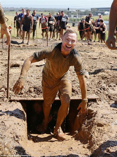 ronan keating cannot stop grinning as he gets muddy with girlfriend storm at tough mudder