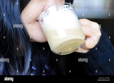A Woman S Drinking A Cup Of Coffee Stock Photo Alamy