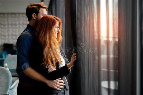 Romantic Couple Staring Though Window And Daydreaming Stock Photo Image Of Affectionate