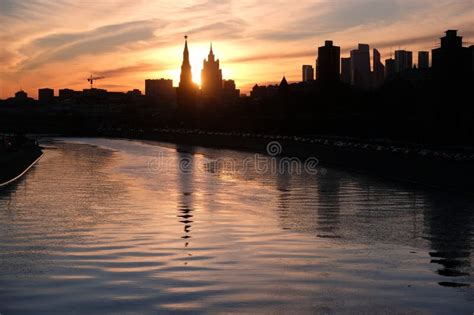 Moscow River Embankment And Silhouettes Of Buildings And Kremlin