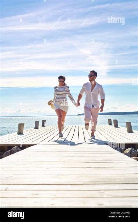 Young Couple Holding Hands On Pier Gavle Sweden Stock Photo Alamy