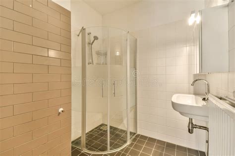 A White Bathroom With A Shower And A Sink Stock Photo Image Of House