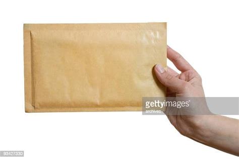 Hand Giving Envelope Photos And Premium High Res Pictures Getty Images