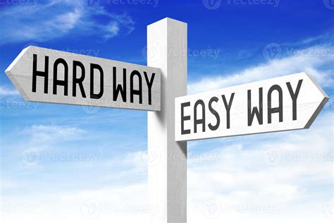 Easy Way Hard Way Wooden Signpost With Two Arrows And Sky In