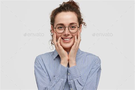 Positive Satisfied Young Woman Has Freindly Gentle Smile Touches