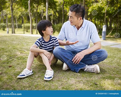 Asian Father And Son Having A Conversation Stock Image Image Of