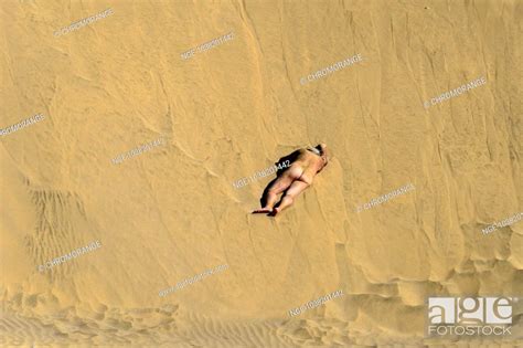 A Naked Man Lying In The Dunes Of Maspalomas Stock Photo Picture And