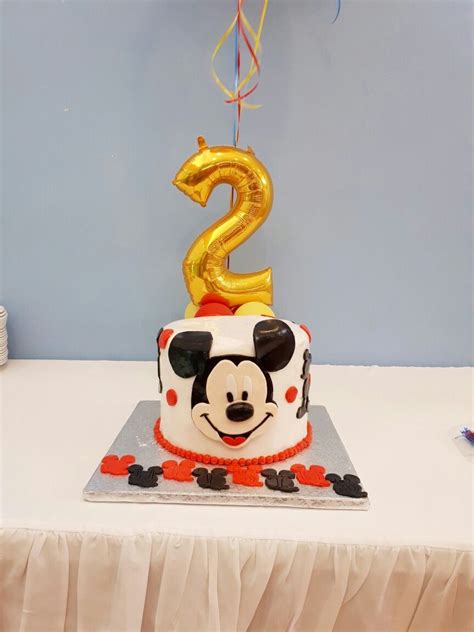 Step 2.to make the cake step 2.to make the cake add two spoons of magic, one tinker belle wing (they are very rare and cannot be found in tescos maybe asda) one knob. Mickey mouse birthday cake.... 2 years old birthday boy ...