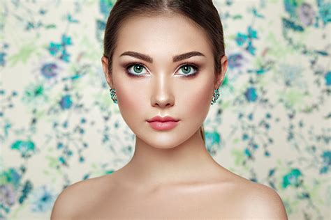 Portrait Of Young Beautiful Woman On A Background Of Flowers By Oleg