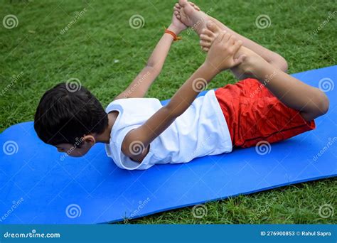 Asian Smart Kid Doing Yoga Pose In The Society Park Outdoor Children S
