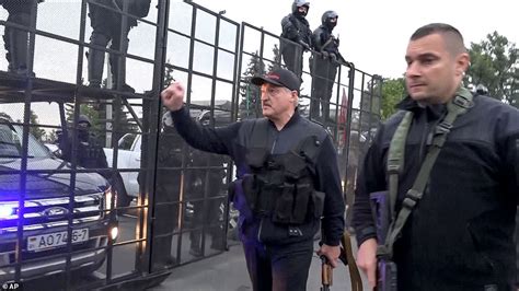 Belarus President Lukashenko Waves Assault Rifle And Wears Body Armour