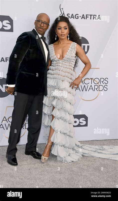 courtney b vance left and angela bassett arrive at the 25th annual screen actors guild awards