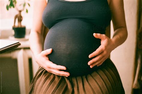 a belly on ninth month of pregnancy by stocksy contributor anna malgina stocksy