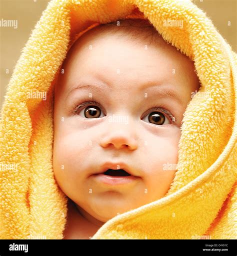 Cute Baby Face Wrapped In Towel Hygiene And Health Care Concept Stock