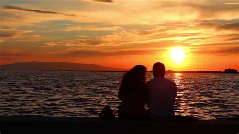 Couple On The Shore Of The Sea Romantic Couple At Sunset Two People In Love At Sunset Man And