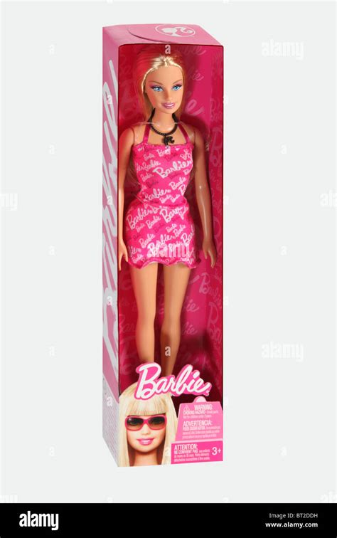 Barbie Doll Wearing A Pink Dress And Name Barbie Across The Dress